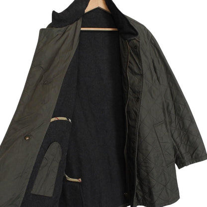 Burberry khaki green quilted field jacket with Nova Check pattern and logo details.