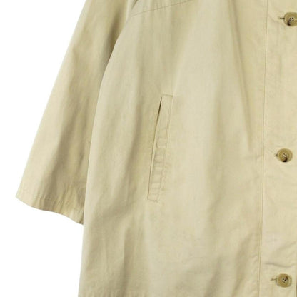Burberry beige single breasted coat with logo detail and classic tailored design.