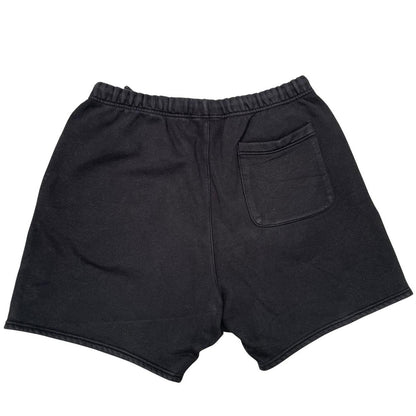 Essentials black jogger shorts cotton material with faded detailing and logo.