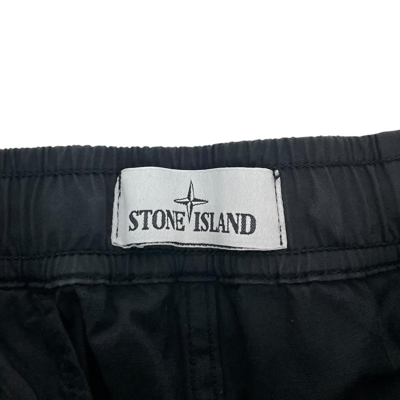 Stone Island black cargo trousers with logo patch and RE-T Fit design.