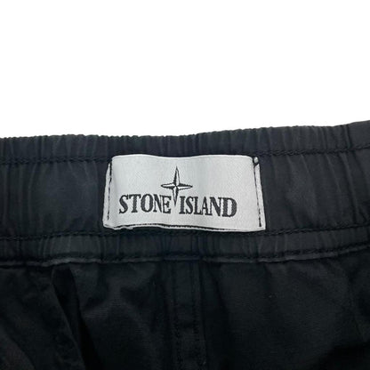 Stone Island black cargo trousers with logo patch and RE-T Fit design.