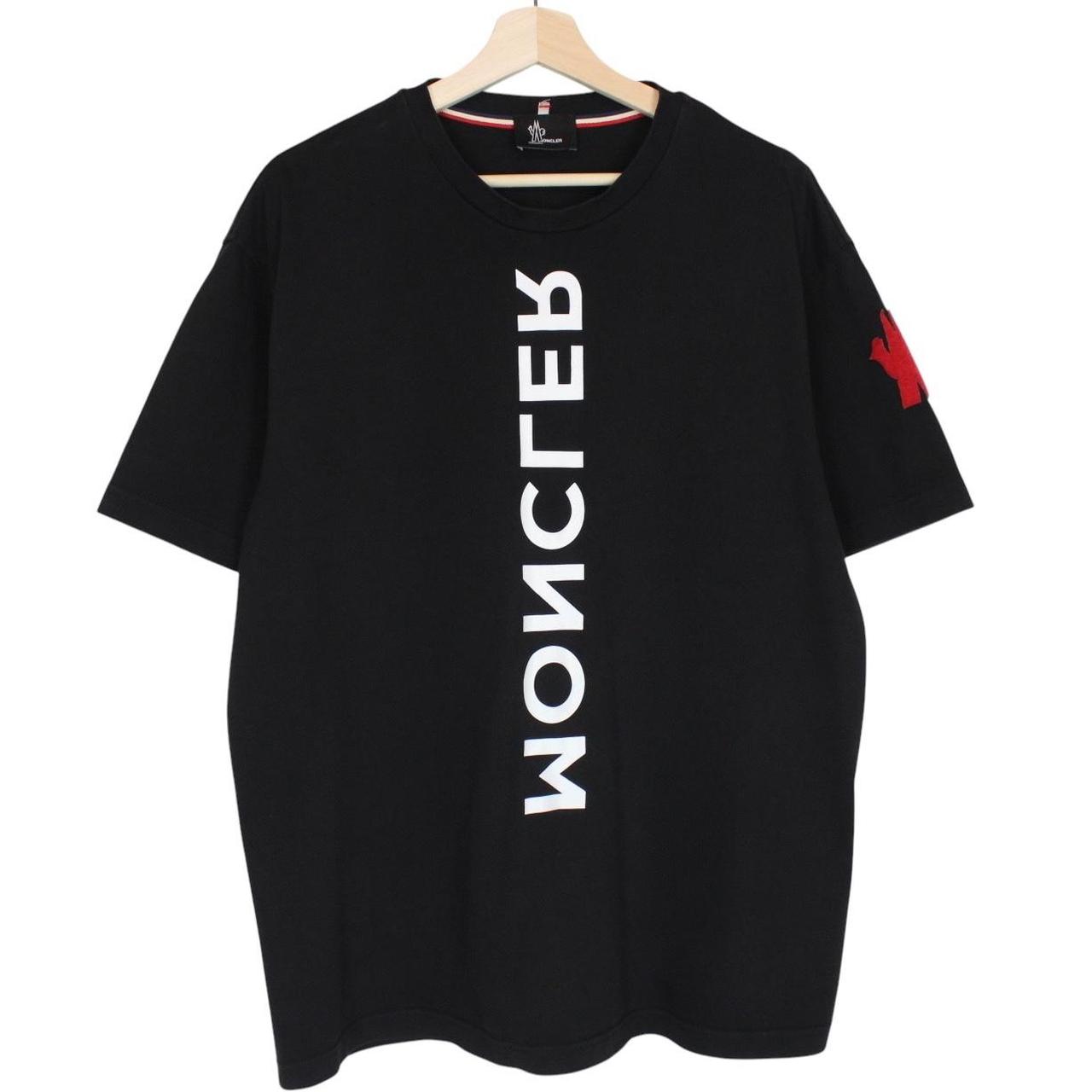 Moncler black and white short sleeve t-shirt with vertical logo design.