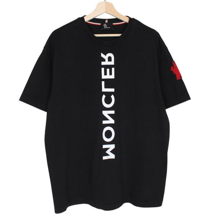 Moncler black and white short sleeve t-shirt with vertical logo design.