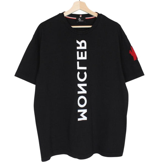 Moncler black and white short sleeve t-shirt with vertical logo design.
