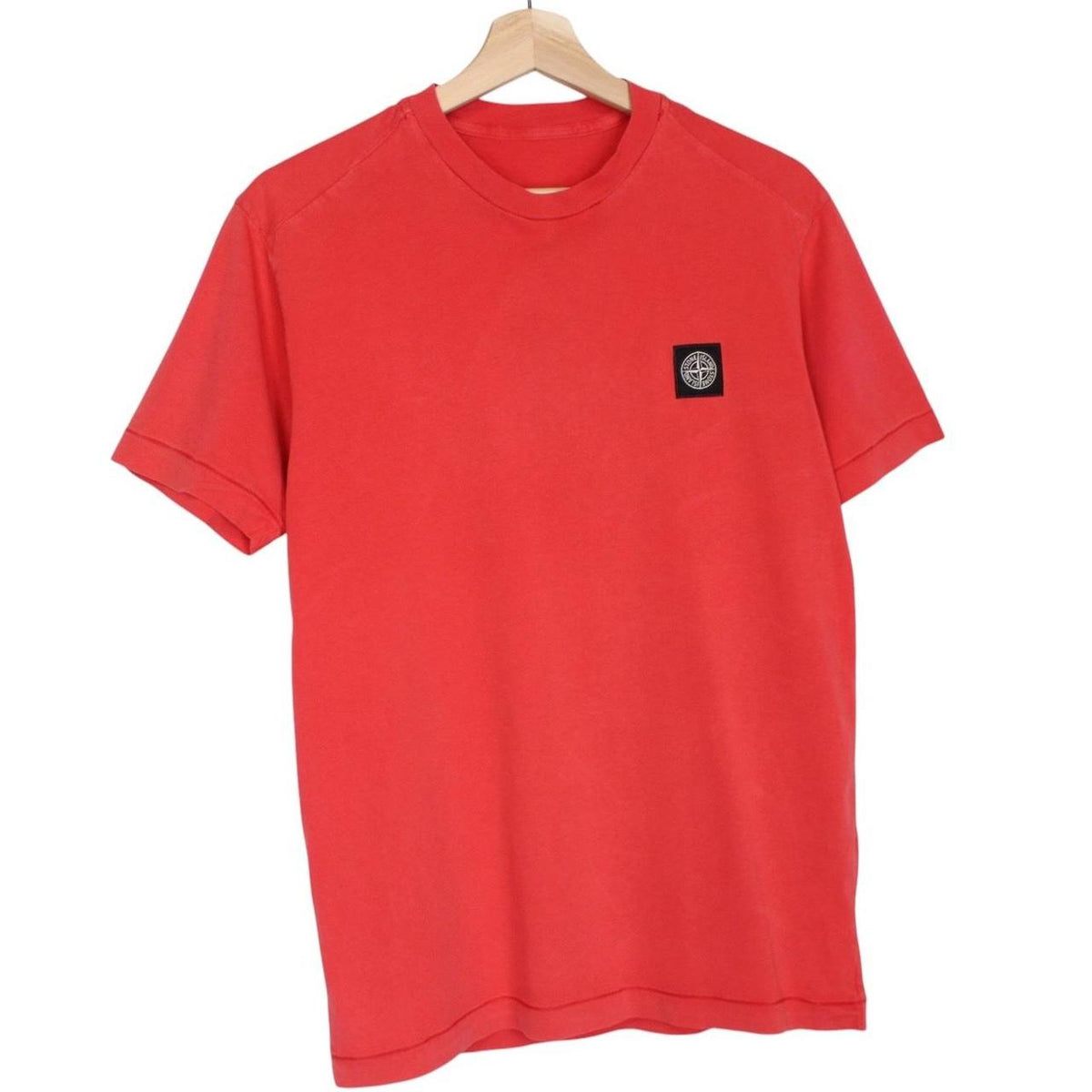 Stone Island red short sleeve cotton t-shirt with compass logo on chest.