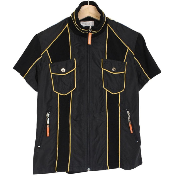 Christian Dior black and yellow jacket with 'Remove Before Flight' graphic detail.