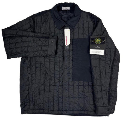 Stone Island black quilted nylon jacket with logo badge and Primaloft-TC material.