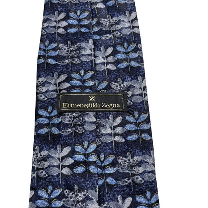 Ermenegildo Zegna blue silk tie with floral print design and logo detail.