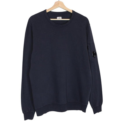 CP Company navy blue cotton sweatshirt with goggle lens detail and logo.