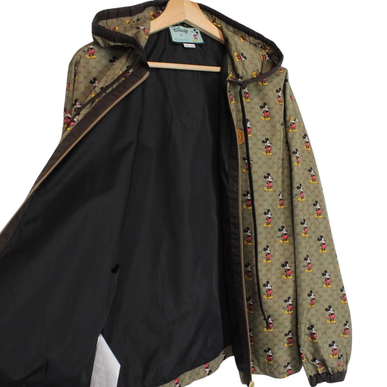 Gucci x Disney khaki brown windbreaker jacket with monogram pattern and nylon material.