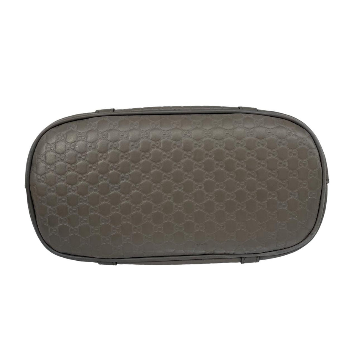 Gucci grey microguccissima mini dome shoulder bag with embossed logo and leather material.