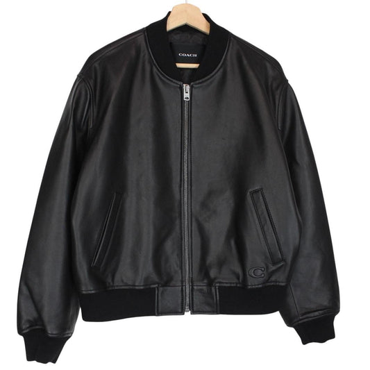 Coach black lamb leather bomber jacket with full zip and brand logo.