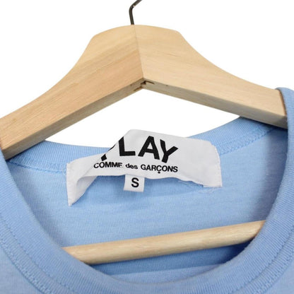Comme des Garcons light blue short sleeve cotton t-shirt with heart logo and pocket.