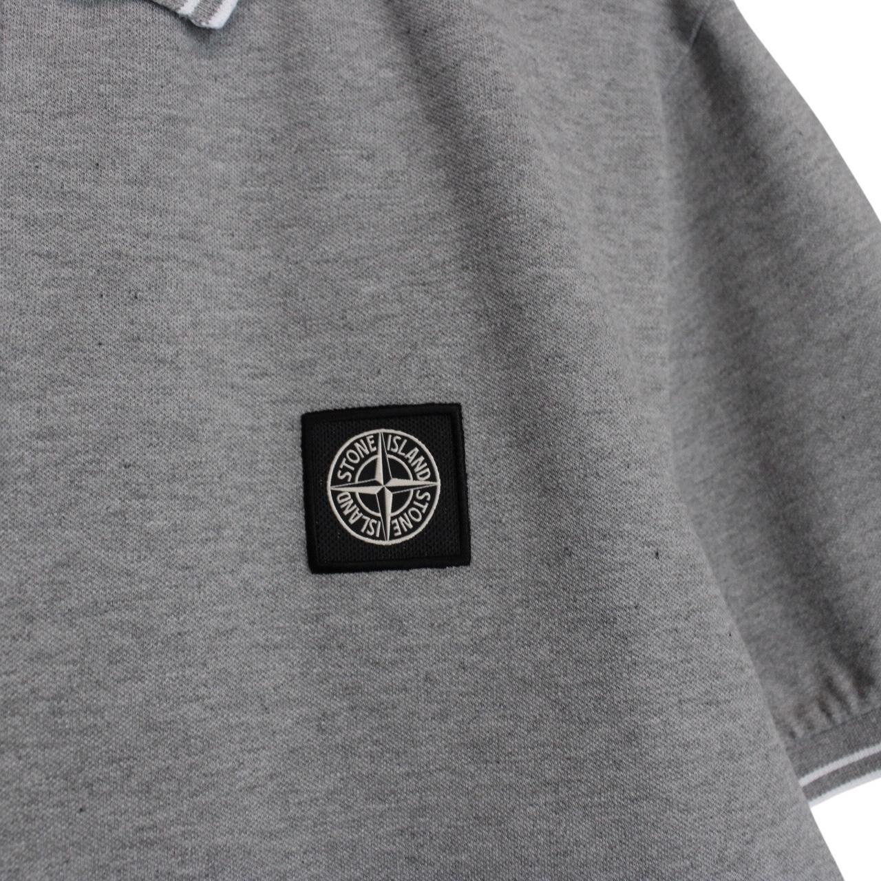 Stone Island grey polo shirt with embroidered compass logo and cotton material.