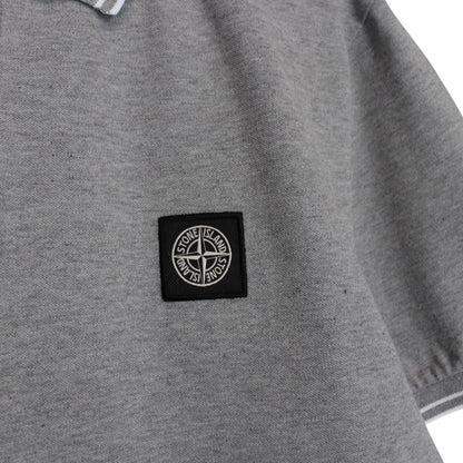 Stone Island grey polo shirt with embroidered compass logo and cotton material.