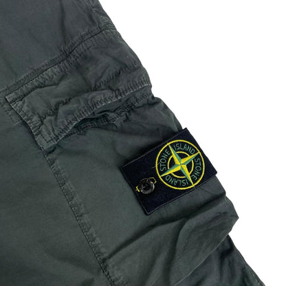 Stone Island grey cargo trousers with logo patch and loose stitch detail.