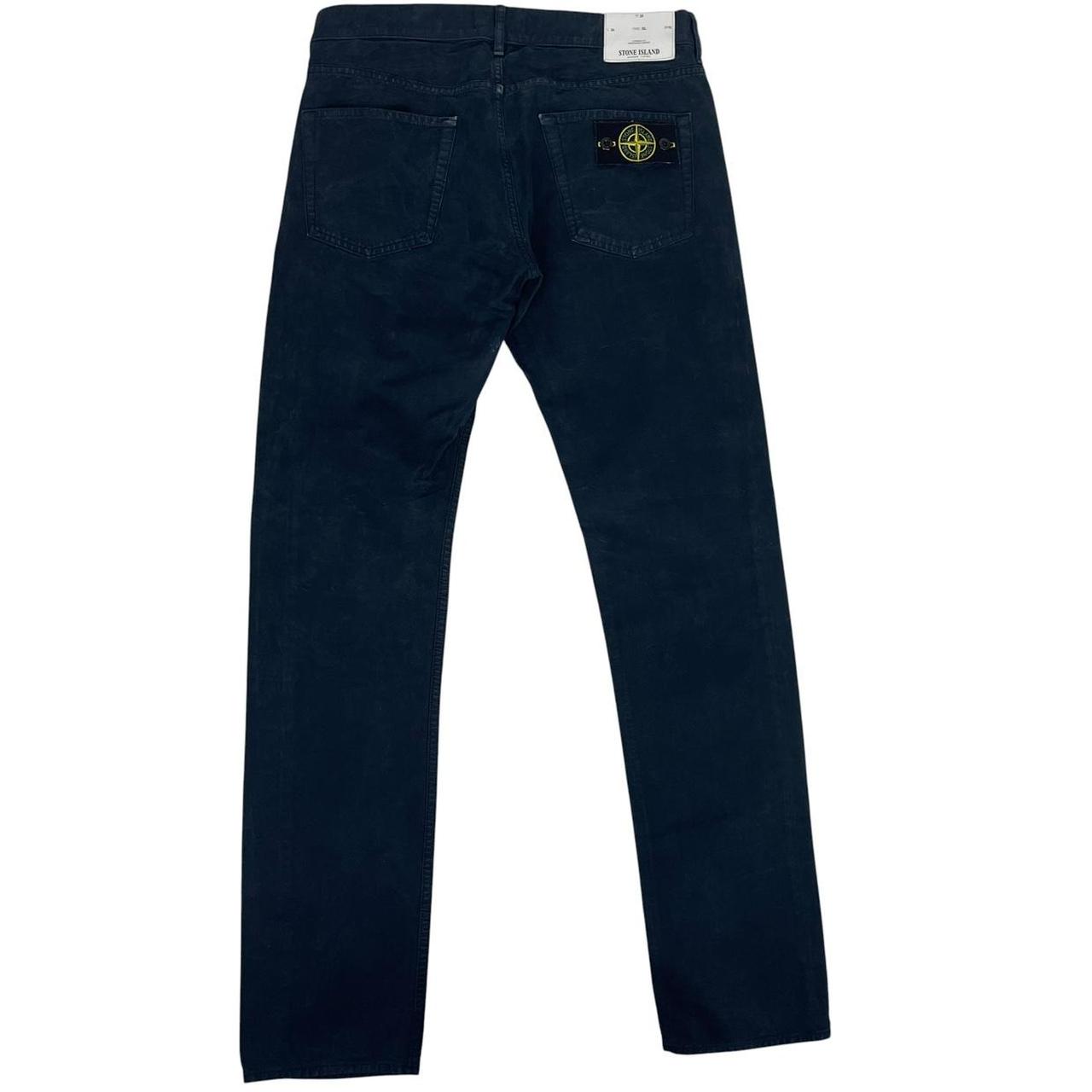 Stone Island navy blue slim fit cotton trousers with logo patch and side pockets.