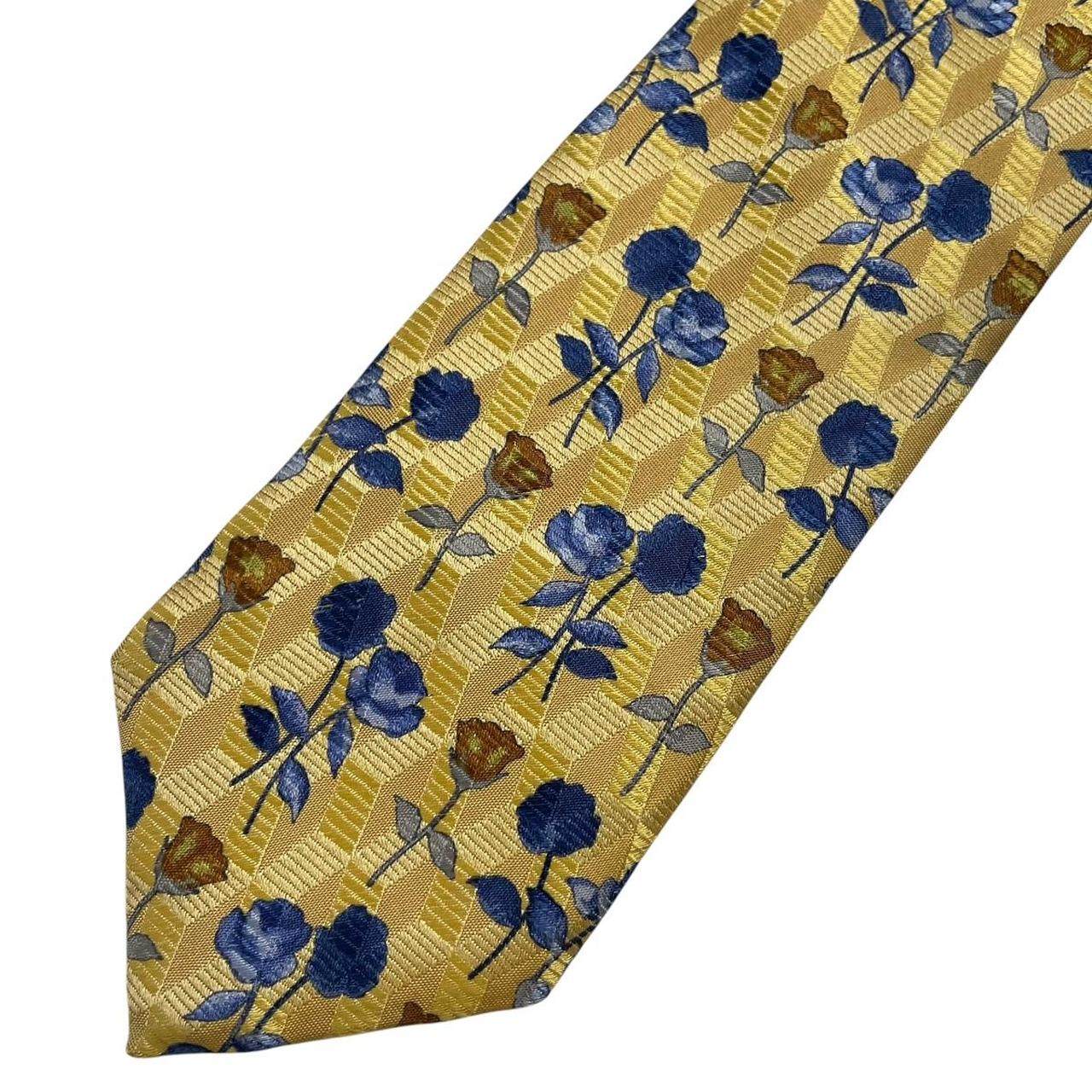 Ermenegildo Zegna yellow silk tie with floral pattern and logo detail.