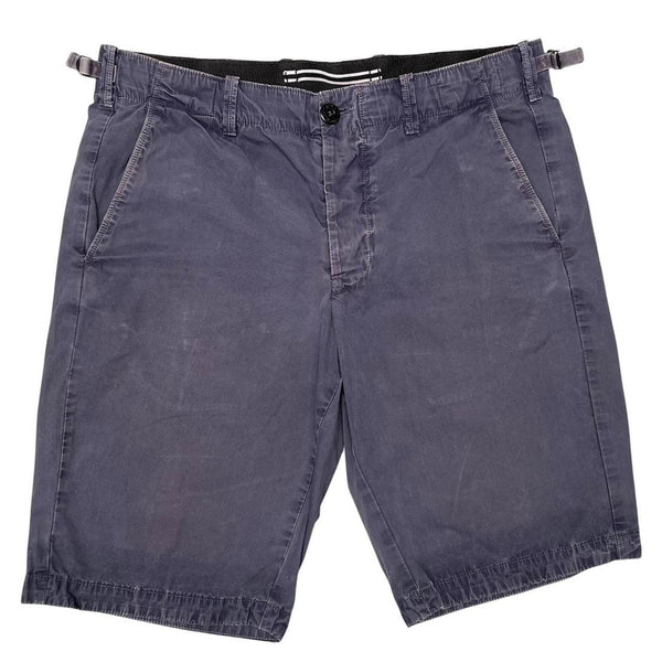 Stone Island navy blue Bermuda shorts with logo patch and cotton material.