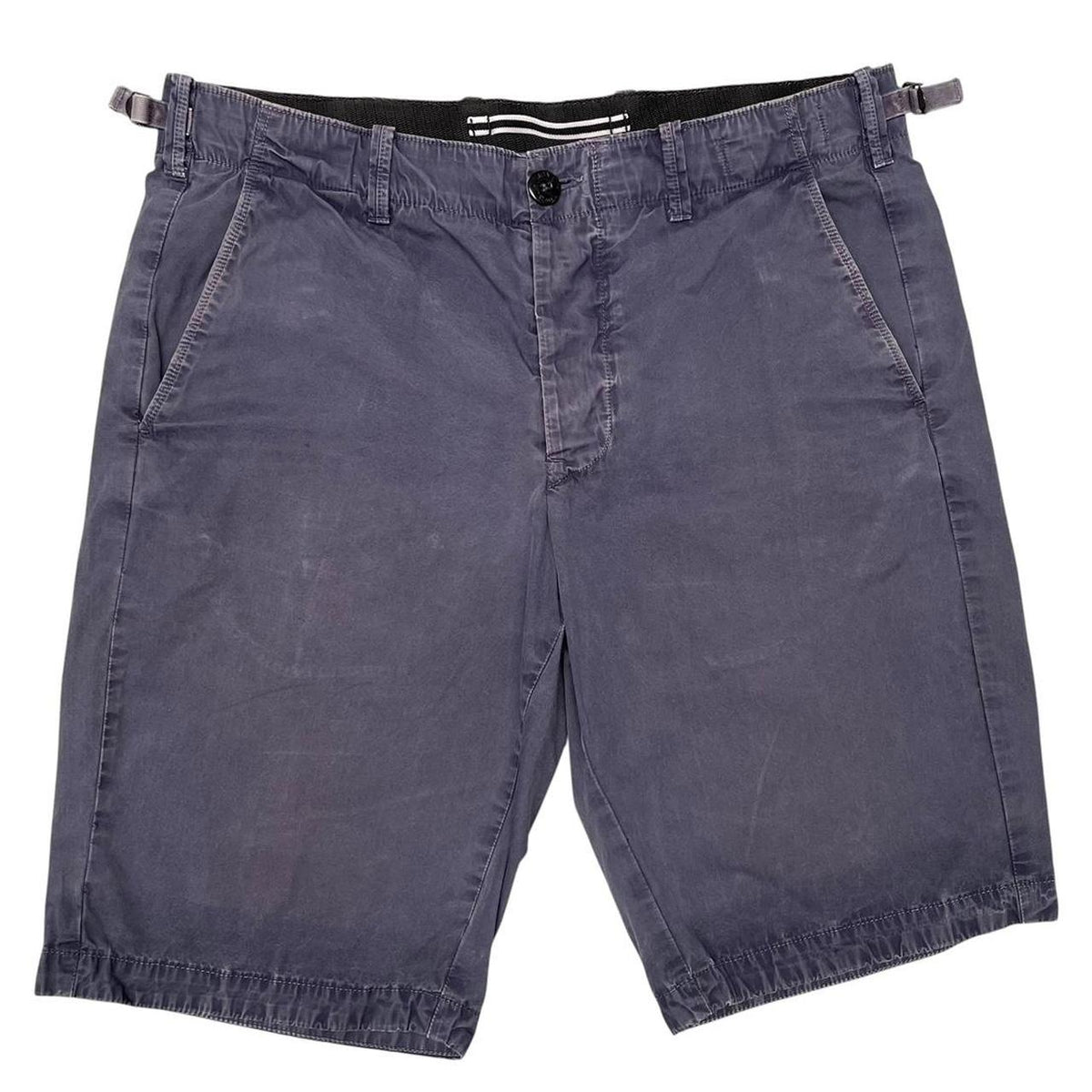 Stone Island navy blue Bermuda shorts with logo patch and cotton material.