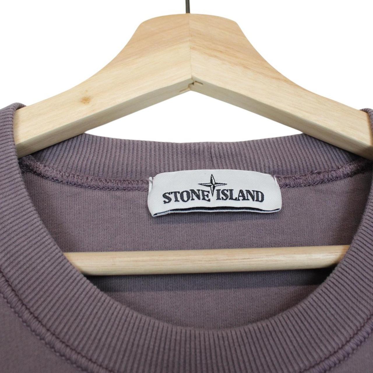 Stone Island pink sweatshirt with logo patch and soft cotton material.
