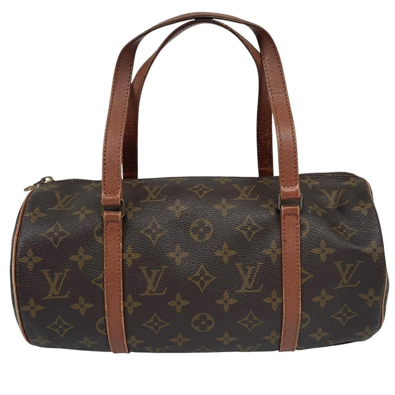 Louis Vuitton duffel bag brown and tan monogram canvas with logo pattern and wear.
