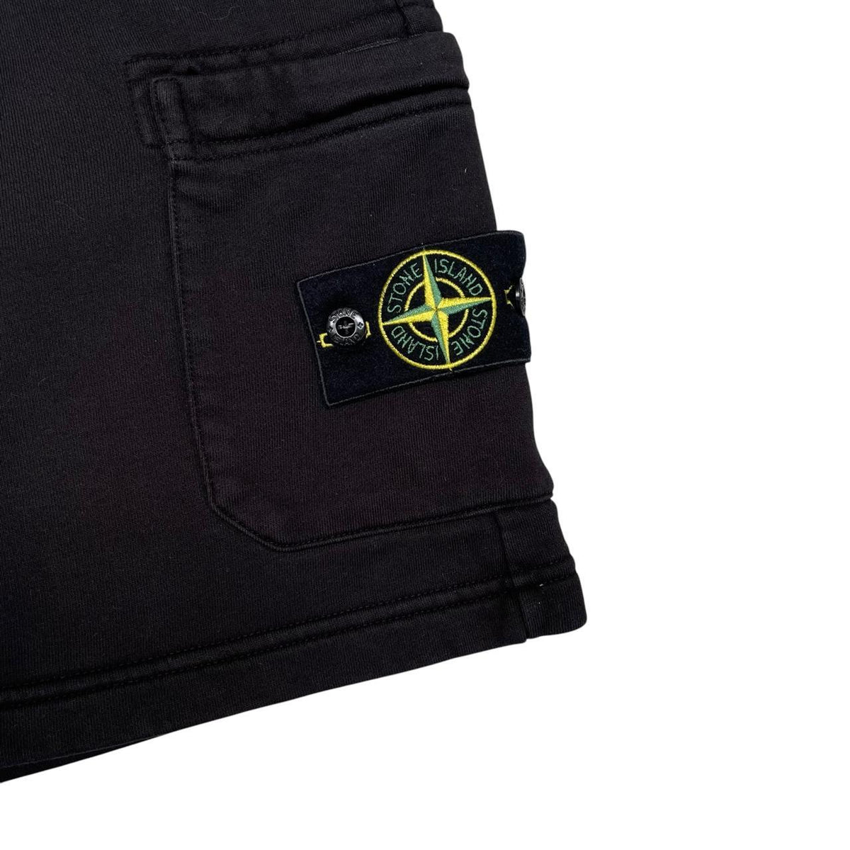 Stone Island black jogger shorts with logo patch and cotton material.