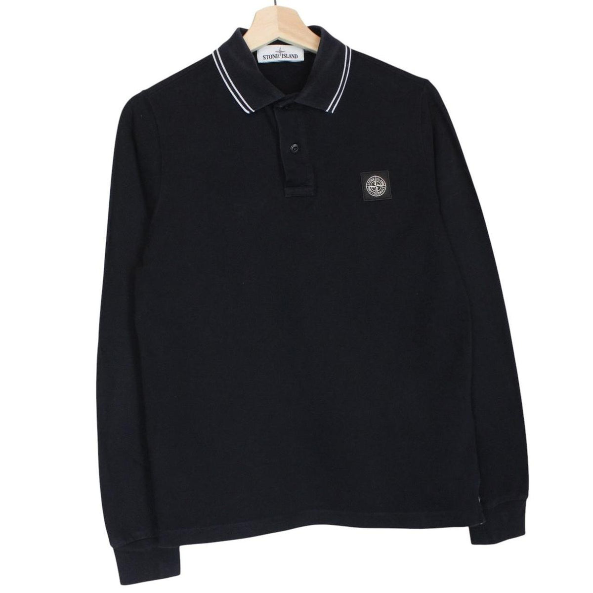Stone Island black long sleeve polo shirt with embroidered compass logo, slim fit.