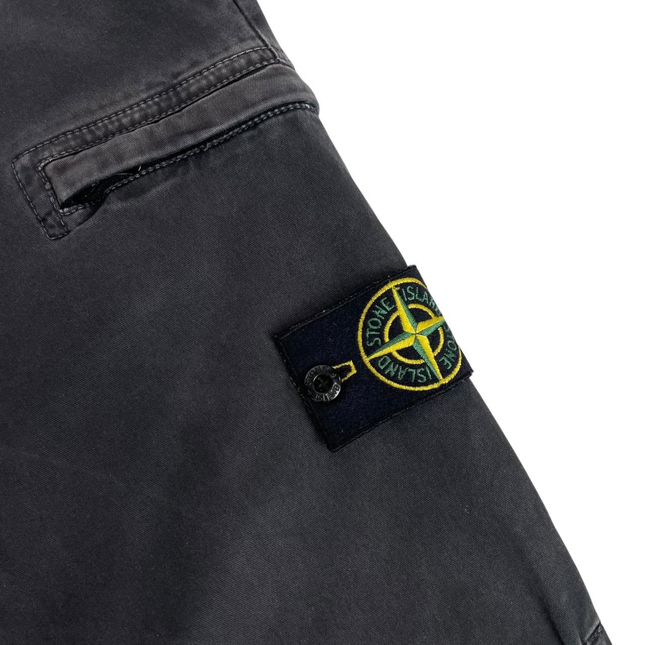 Stone Island black skinny fit cargo trousers with logo patch and multiple pockets.