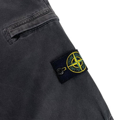 Stone Island black skinny fit cargo trousers with logo patch and multiple pockets.