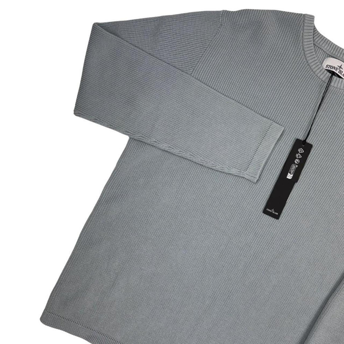 Stone Island grey waffle knit jumper with logo patch and organic cotton material.
