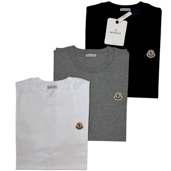 Moncler pocket t-shirts in black, grey, and white with patch logo details.
