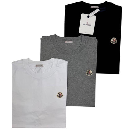 Moncler pocket t-shirts in black, grey, and white with patch logo details.