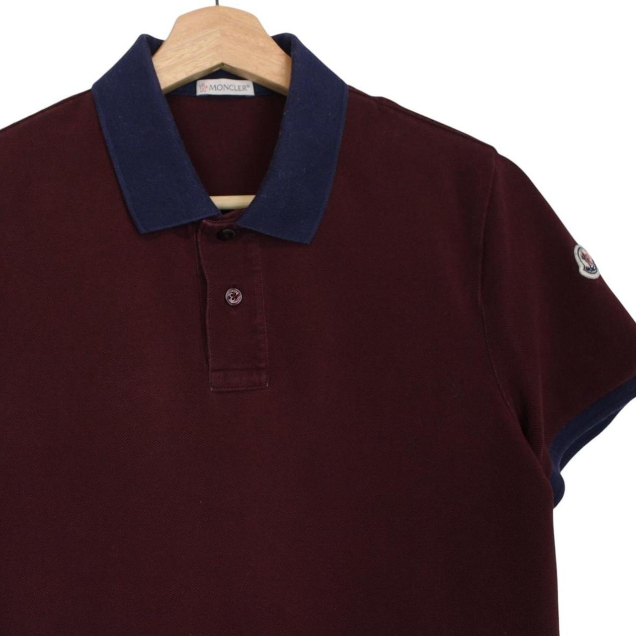Moncler burgundy short sleeve polo shirt with logo detail and cotton material.