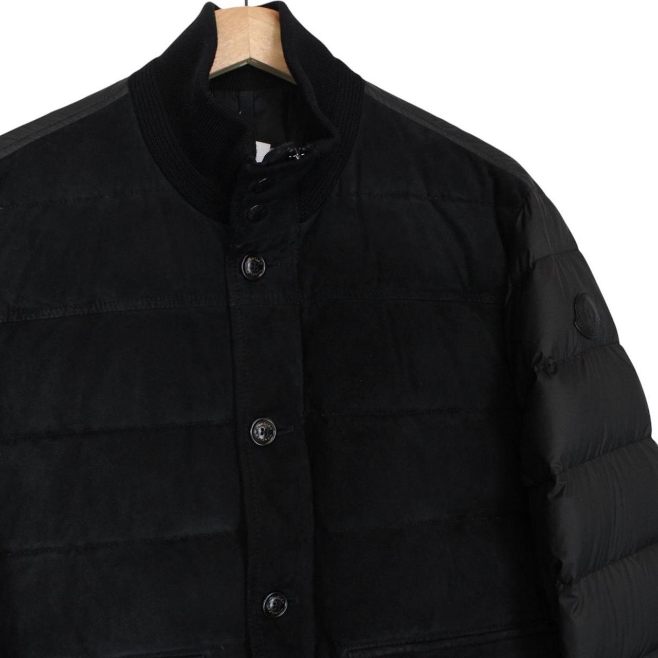 Moncler black suede leather down jacket with full zip and missing badge detail.