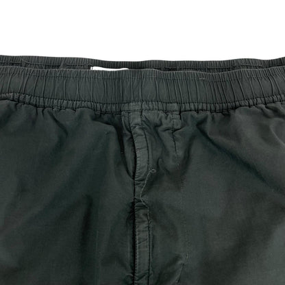 Stone Island grey cargo trousers with logo patch and loose stitch detail.