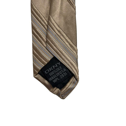 DKNY gold silk tie with vertical stripes and logo detail.