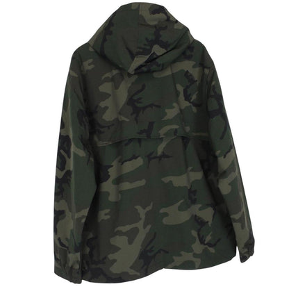 Carhartt camouflage hooded pullover jacket with logo and durable material.