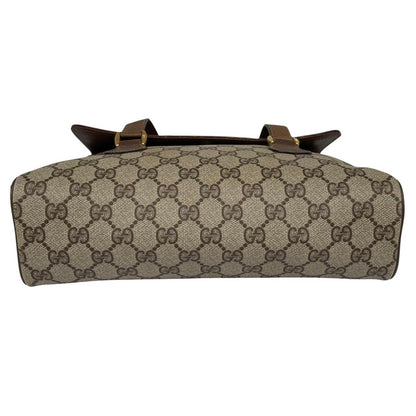Gucci brown duffel bag with monogram canvas and top handle design.