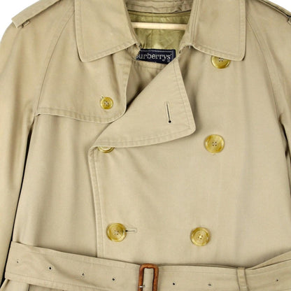 Burberry beige trench coat with Nova Check pattern, double-breasted and belted design.