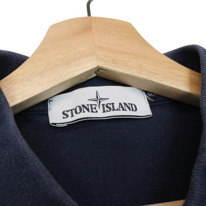 Stone Island navy blue polo shirt with embroidered compass logo and cotton material.