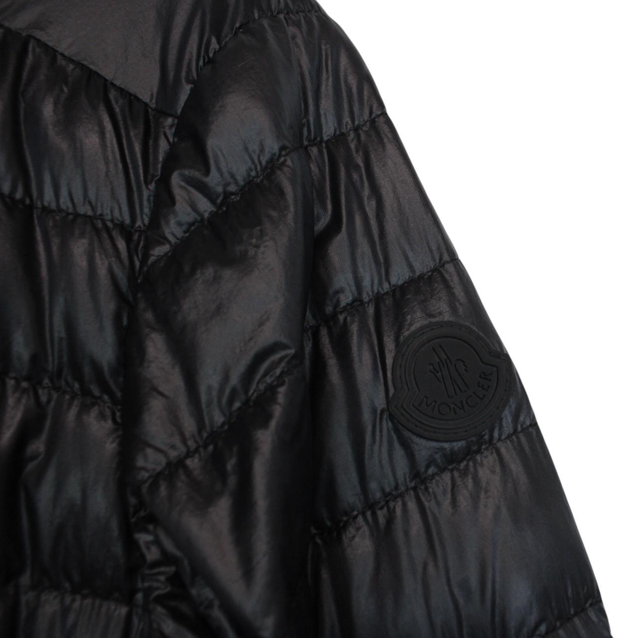 Moncler black lightweight down jacket with full zip and logo patch on sleeve.