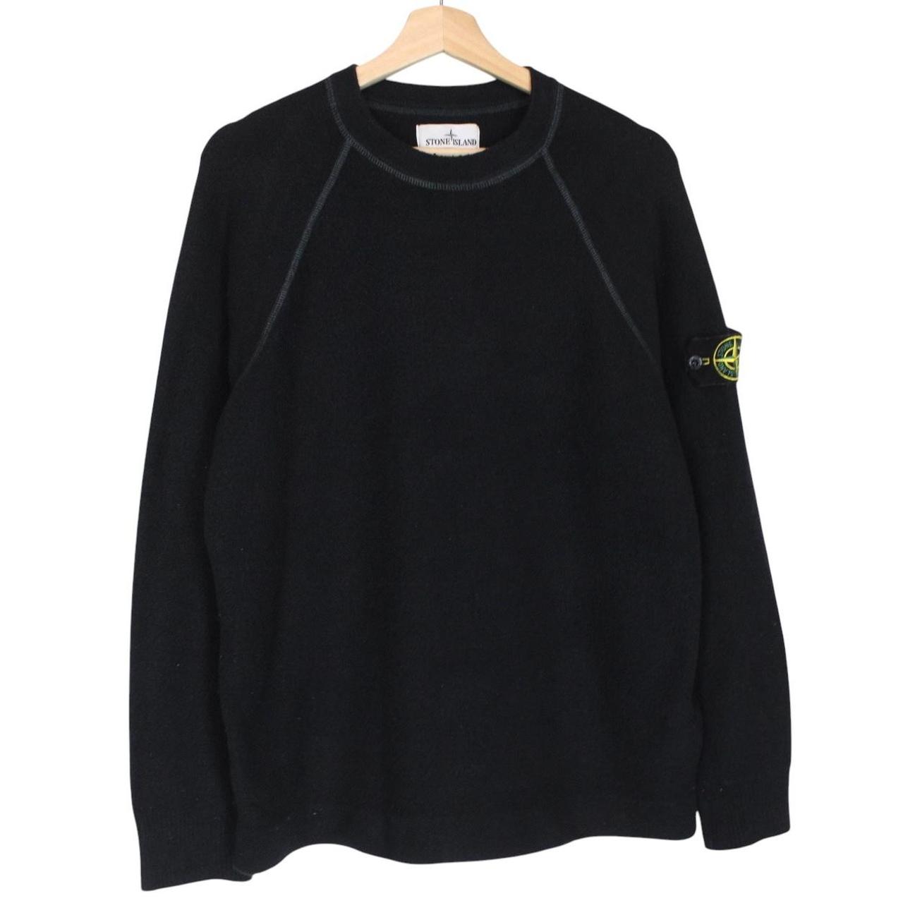 Stone Island black knit jumper with logo badge and cotton/nylon blend material.