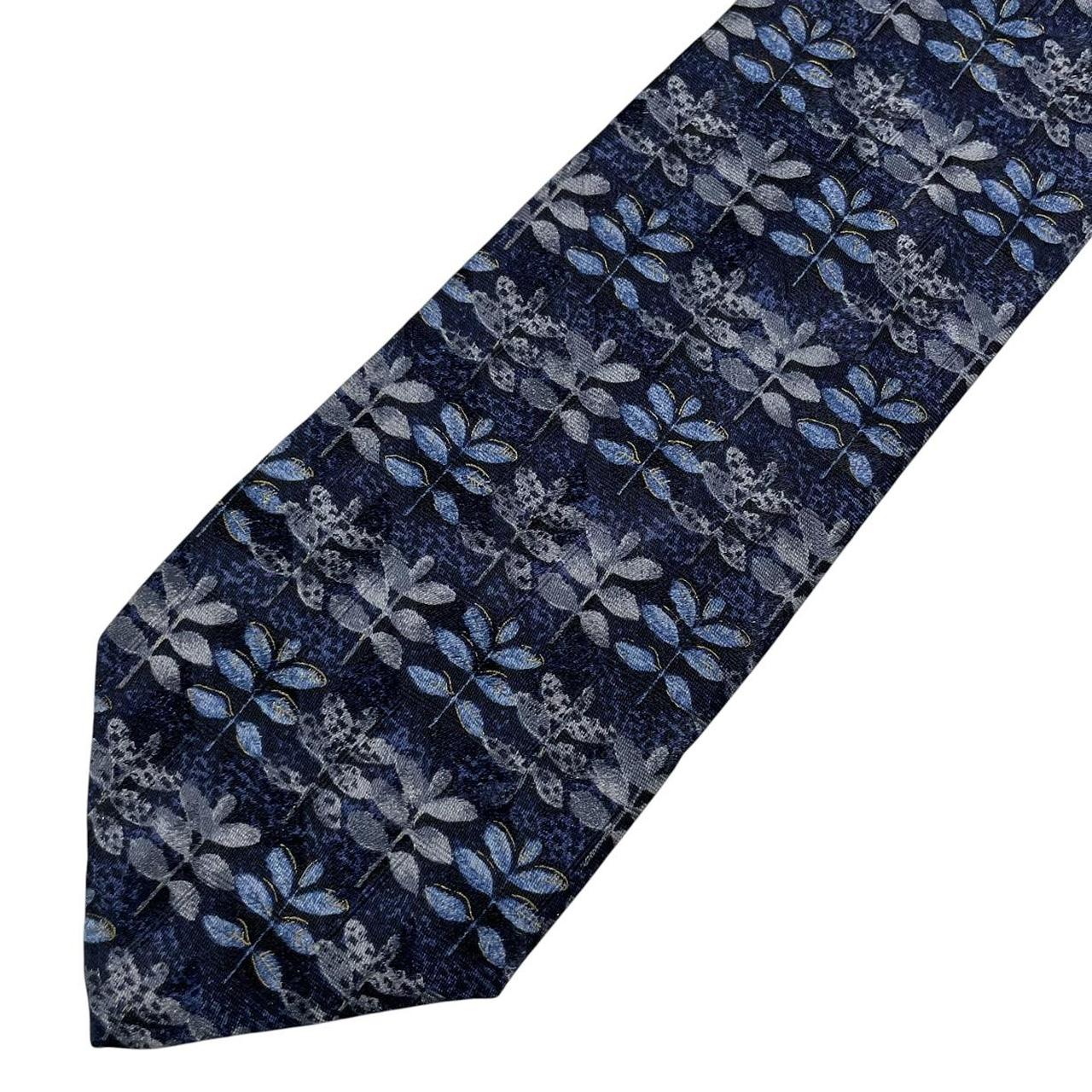 Ermenegildo Zegna blue silk tie with floral print design and logo detail.