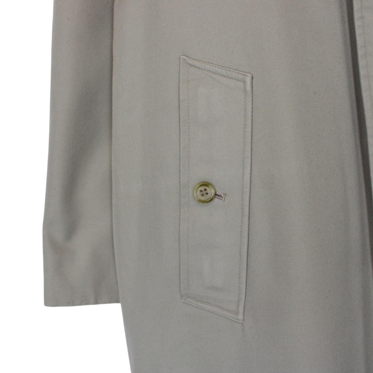 Burberry khaki green trench coat featuring Nova Check pattern and single breasted design.
