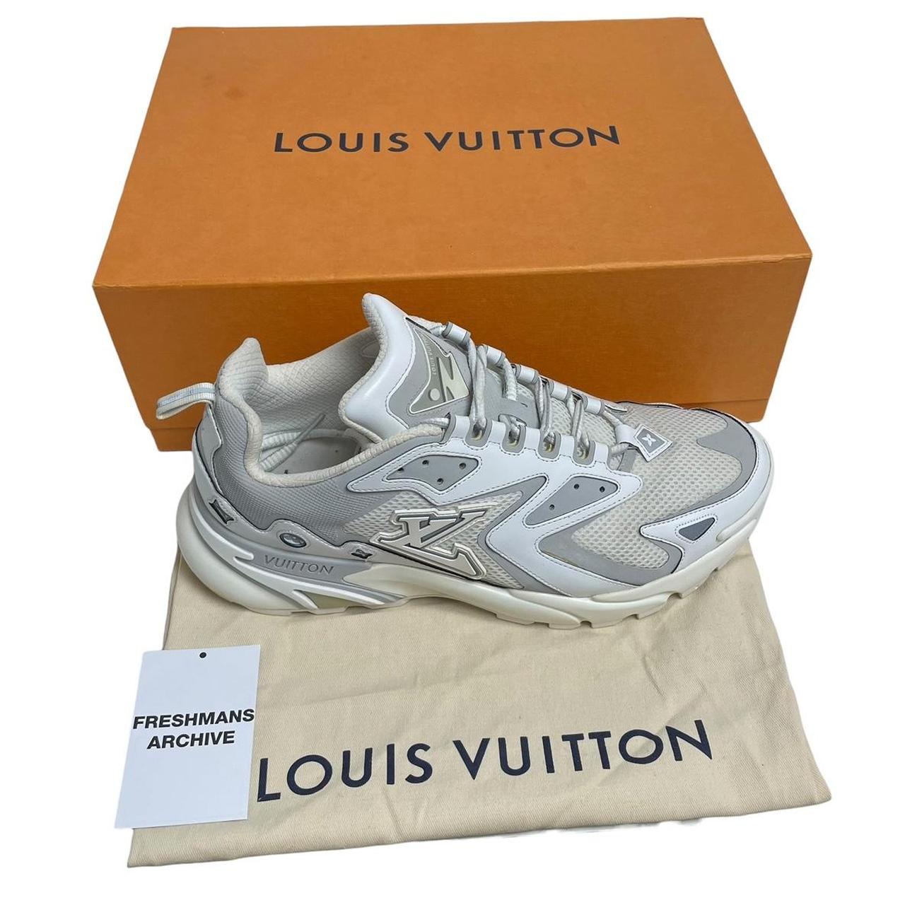 Louis Vuitton white trainers with logo detailing and sleek design, pre-owned condition.