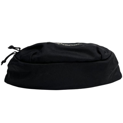 Supreme black waist bag featuring logo print and durable material.