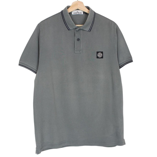 Stone Island grey polo shirt with embroidered compass logo and cotton material.