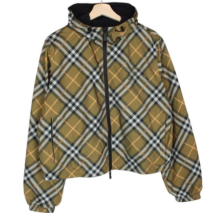 Burberry reversible nylon jacket in brown and black Nova Check pattern with logo.