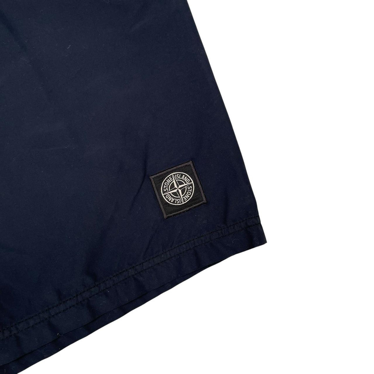 Stone Island navy blue swim shorts brushed nylon fabric with logo patch on side.